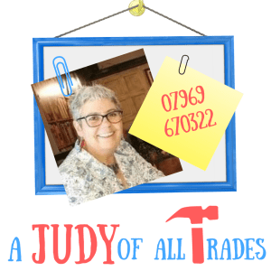 Photo of Judy, a white woman with short grey hair and large glasses.