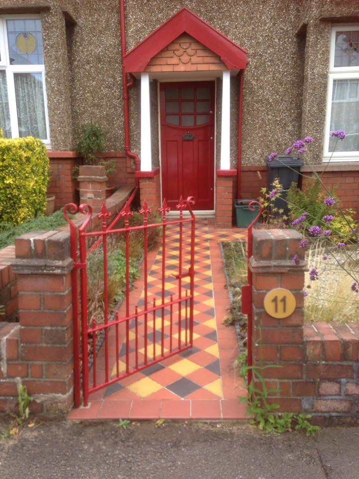 Painted red front door and garden gate